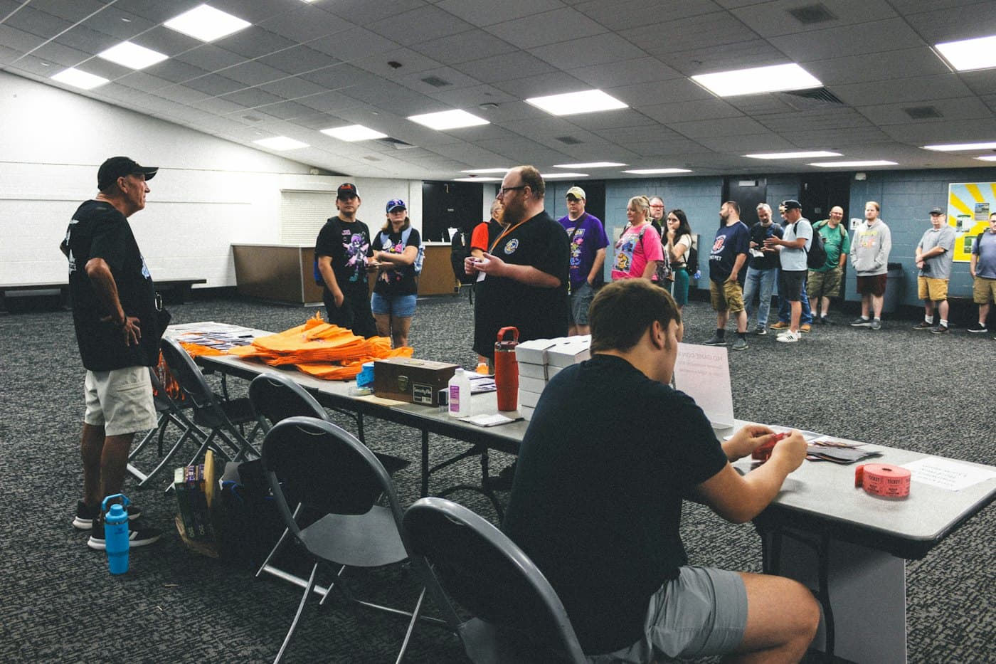 Staff and attendees at a convention registration area